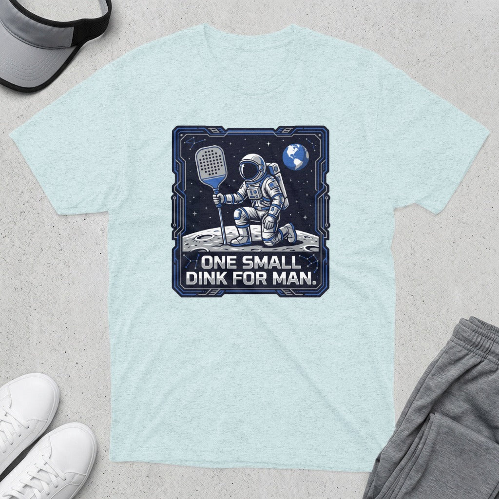 Astronaut kneeling on moon with pickleball paddle, text "One small dink for man."