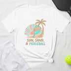 White t-shirt with "Sun, Sand, & Pickleball" text and a pickleball graphic.