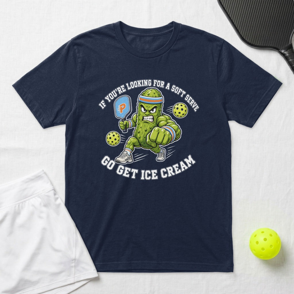 Cartoon pickle wearing a headband and wristbands playing pickleball, text: IF YOU'RE LOOKING FOR A SOFT SERVE GO GET ICE CREAM