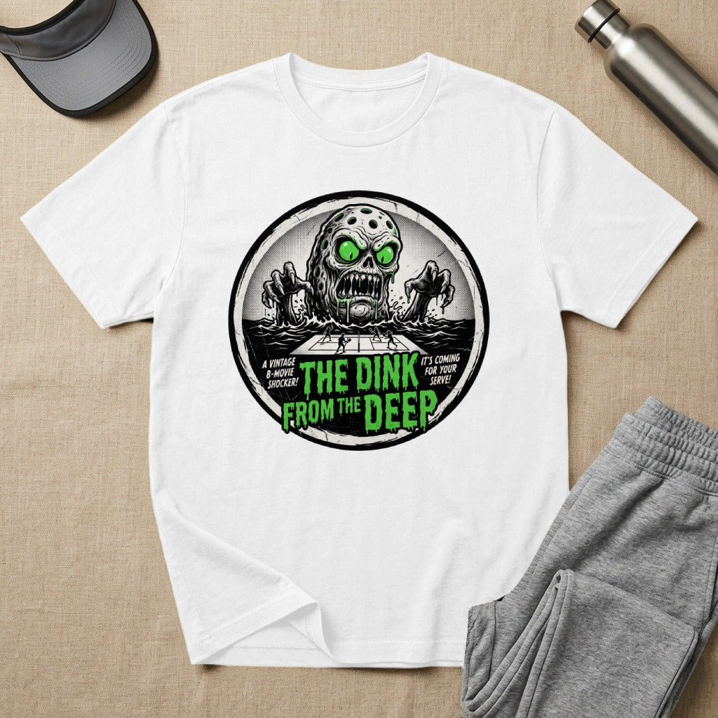 White t-shirt with "The Dink From The Deep" graphic featuring a monster and tennis players.