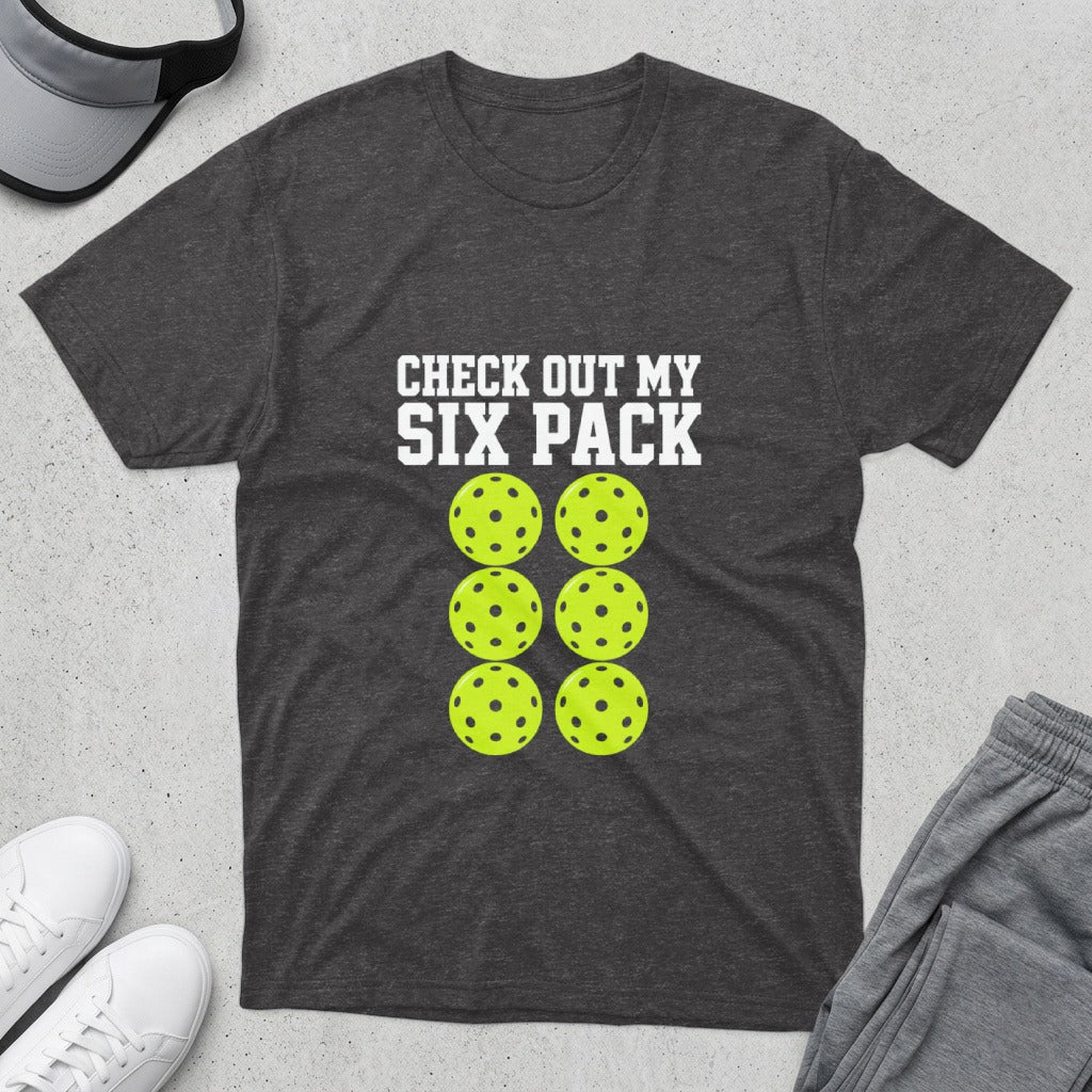 Dark t-shirt with "CHECK OUT MY SIX PACK" and six pickleballs.