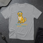 Golden retriever wearing a headband and holding a tennis ball in its mouth.