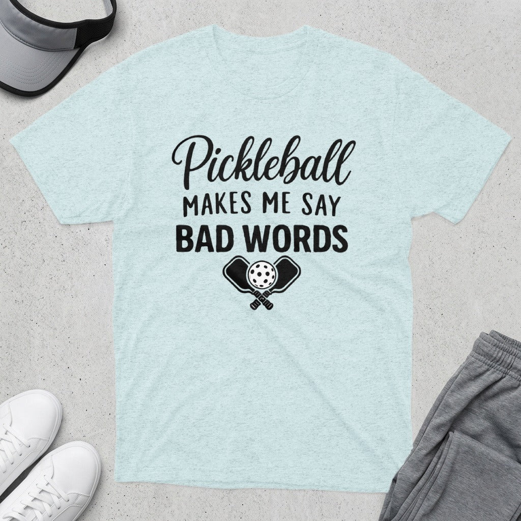 Light heather t-shirt with "Pickleball Makes Me Say Bad Words" and crossed paddles with a pickleball.