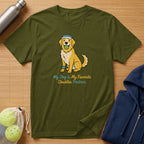 Olive green t-shirt with cartoon dog holding tennis ball, text: My Dog is My Favorite Doubles Partner.