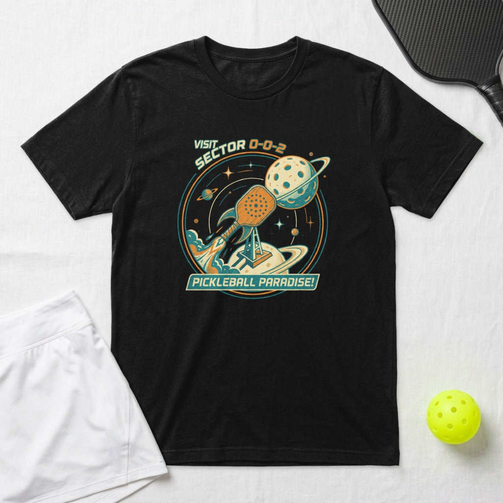 Black t-shirt with vintage space graphic featuring pickleball paddle, planet, and rocket.