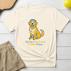 Golden retriever wearing a visor, holding a tennis ball, with text "My Dog Is My Favorite Doubles Partner."