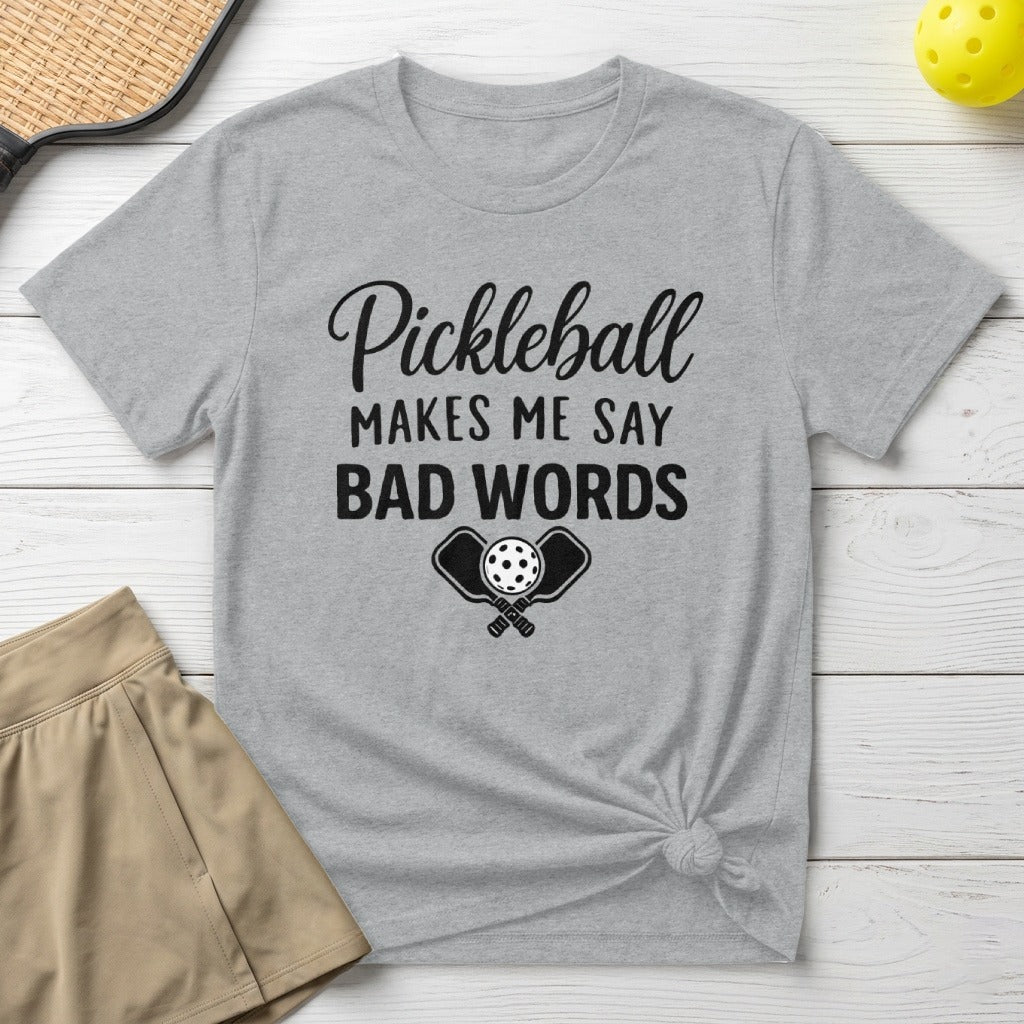 Gray t-shirt with "Pickleball Makes Me Say Bad Words" text and crossed paddles.