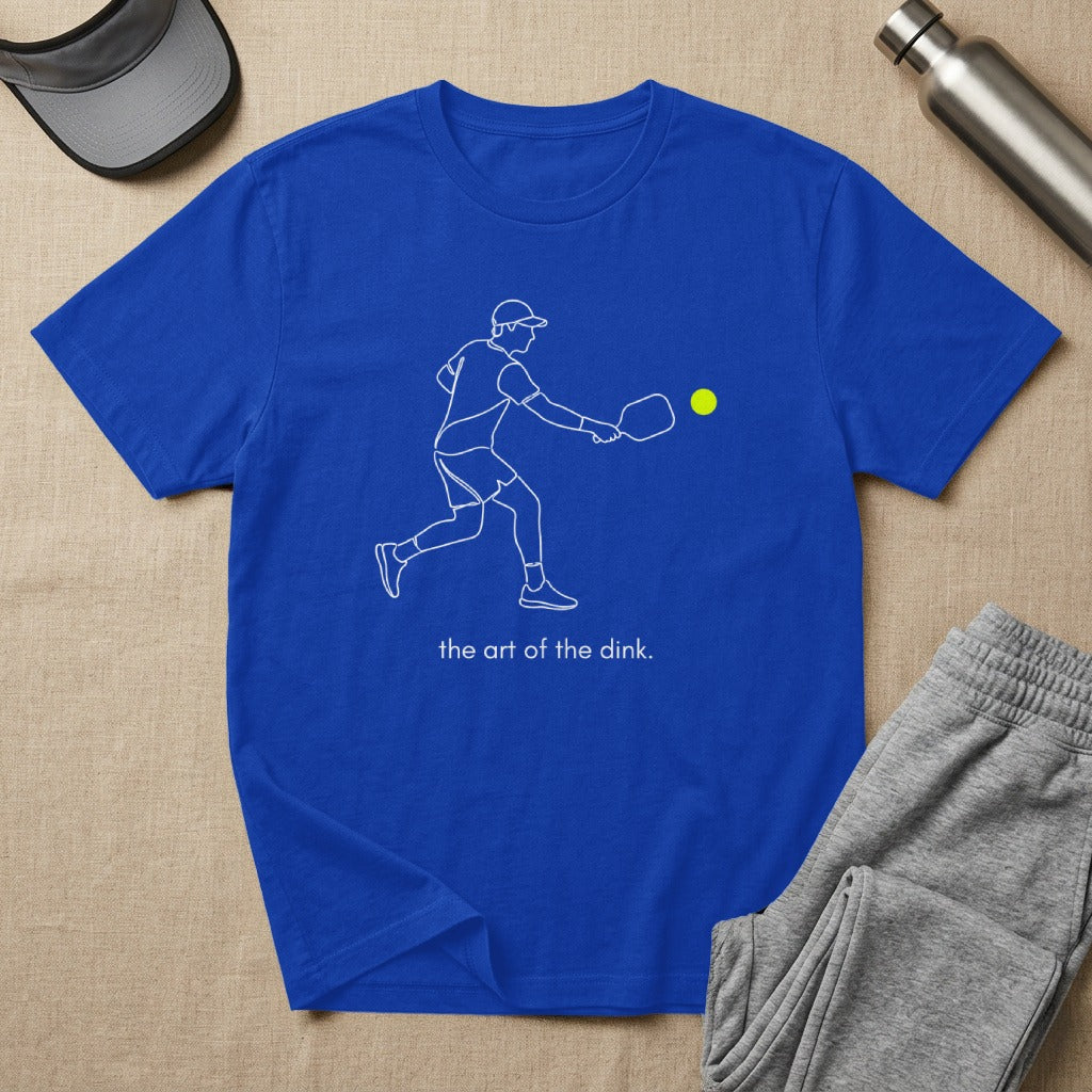 Blue t-shirt with white outline of pickleball player and text "the art of the dink."