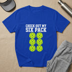 Blue t-shirt with yellow pickleballs and "CHECK OUT MY SIX PACK" text.