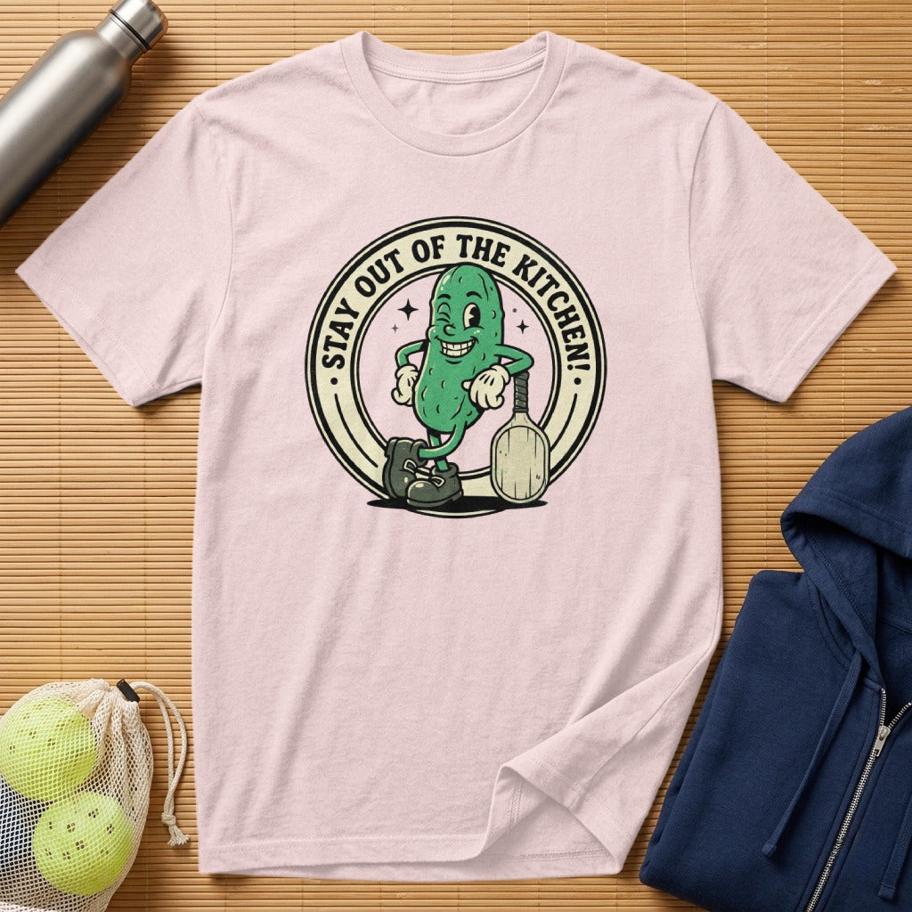 T-shirt with cartoon pickle holding a tennis racket, saying "Stay Out of the Kitchen!".