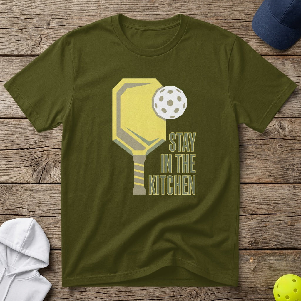 Olive green t-shirt with pickleball paddle and ball graphic, "STAY IN THE KITCHEN" text.