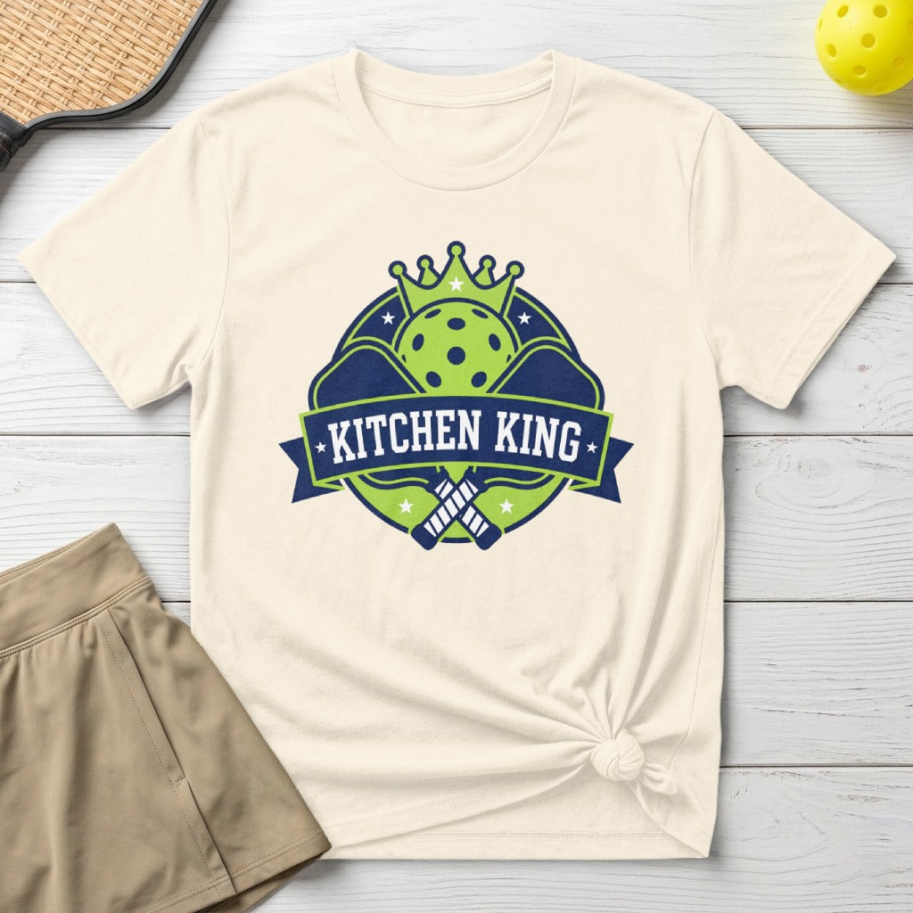 Cream t-shirt with "KITCHEN KING" logo featuring pickleball paddles and crown.