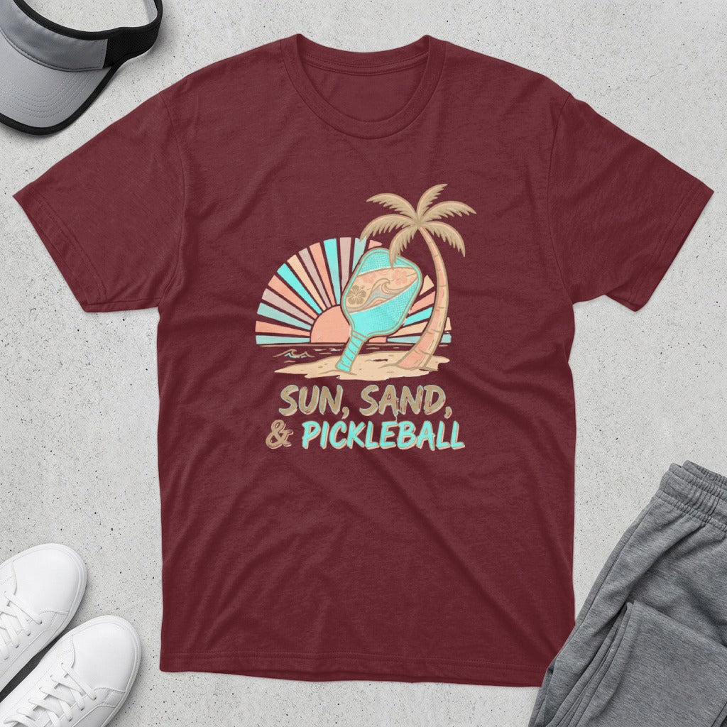 Maroon t-shirt with "Sun, Sand, & Pickleball" graphic featuring a pickleball paddle and palm tree.