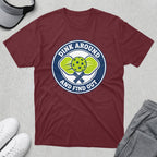 Burgundy t-shirt with a circular logo featuring pickleball paddles and balls, and text "Dink Around and Find Out".