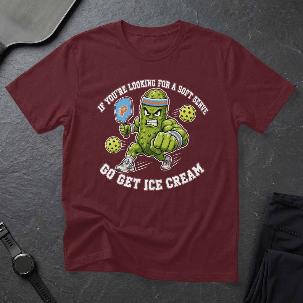 Maroon t-shirt with cartoon pickle playing pickleball and text "GO GET ICE CREAM".