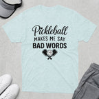 Light blue t-shirt with "Pickleball Makes Me Say Bad Words" and crossed paddles.