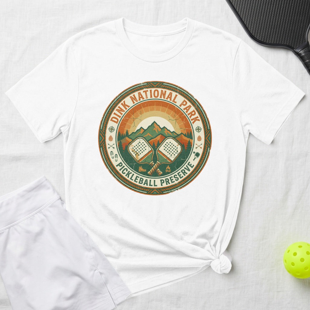 White t-shirt with circular "Dink National Park Pickleball Preserve" graphic.
