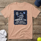 Astronaut on moon holding pickleball paddle, text "One small dink for man."