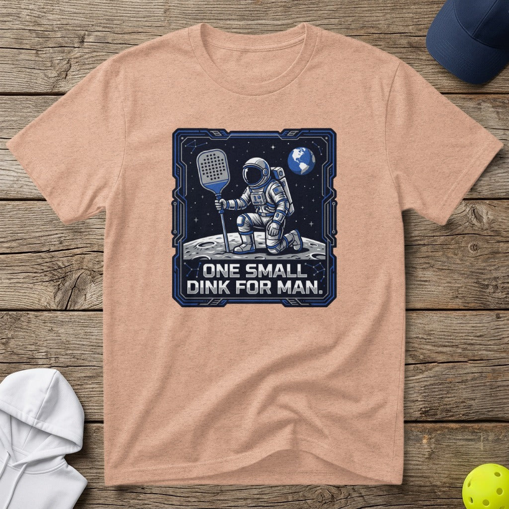 Astronaut on moon holding pickleball paddle, text "One small dink for man."