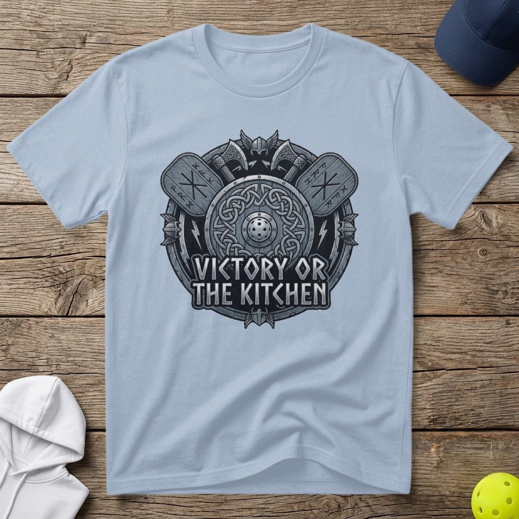 Light blue t-shirt with a circular Viking shield, axes, and the text "Victory or the Kitchen".