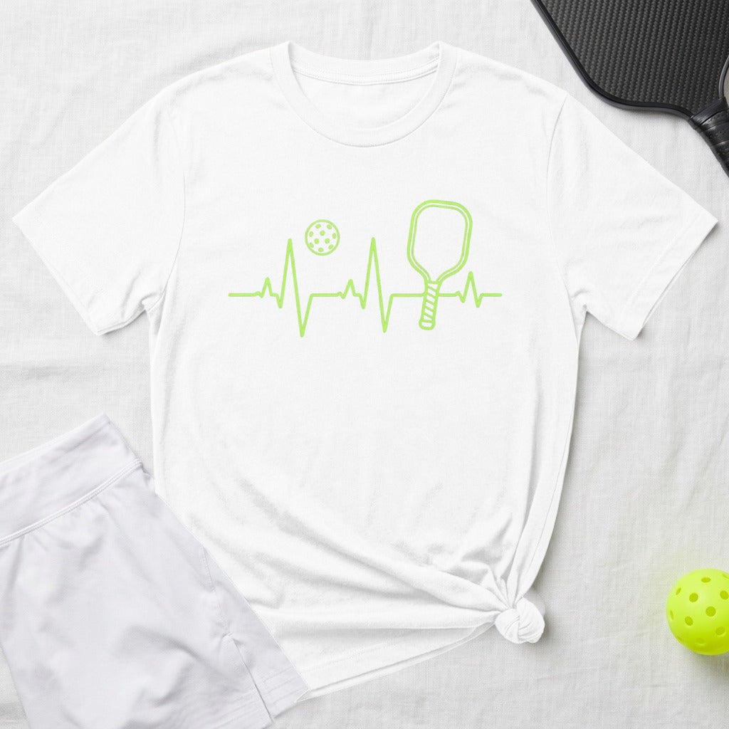 White t-shirt with green pickleball heartbeat graphic and yellow pickleball.