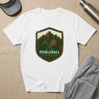 Shield logo with pickleball paddle, pickaxe, and "Pickleball Trailblazers" text.