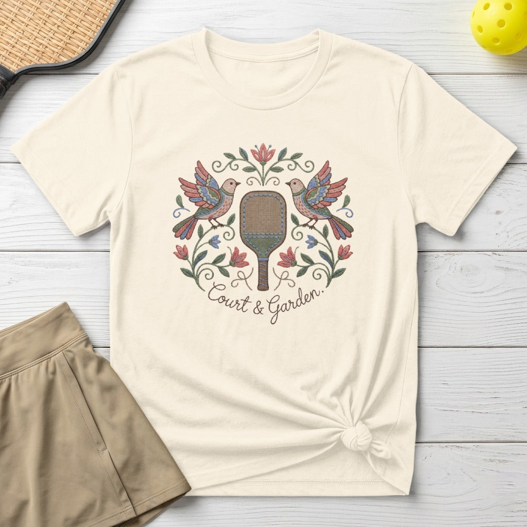 Cream t-shirt with embroidered floral design and "Court & Garden" text.