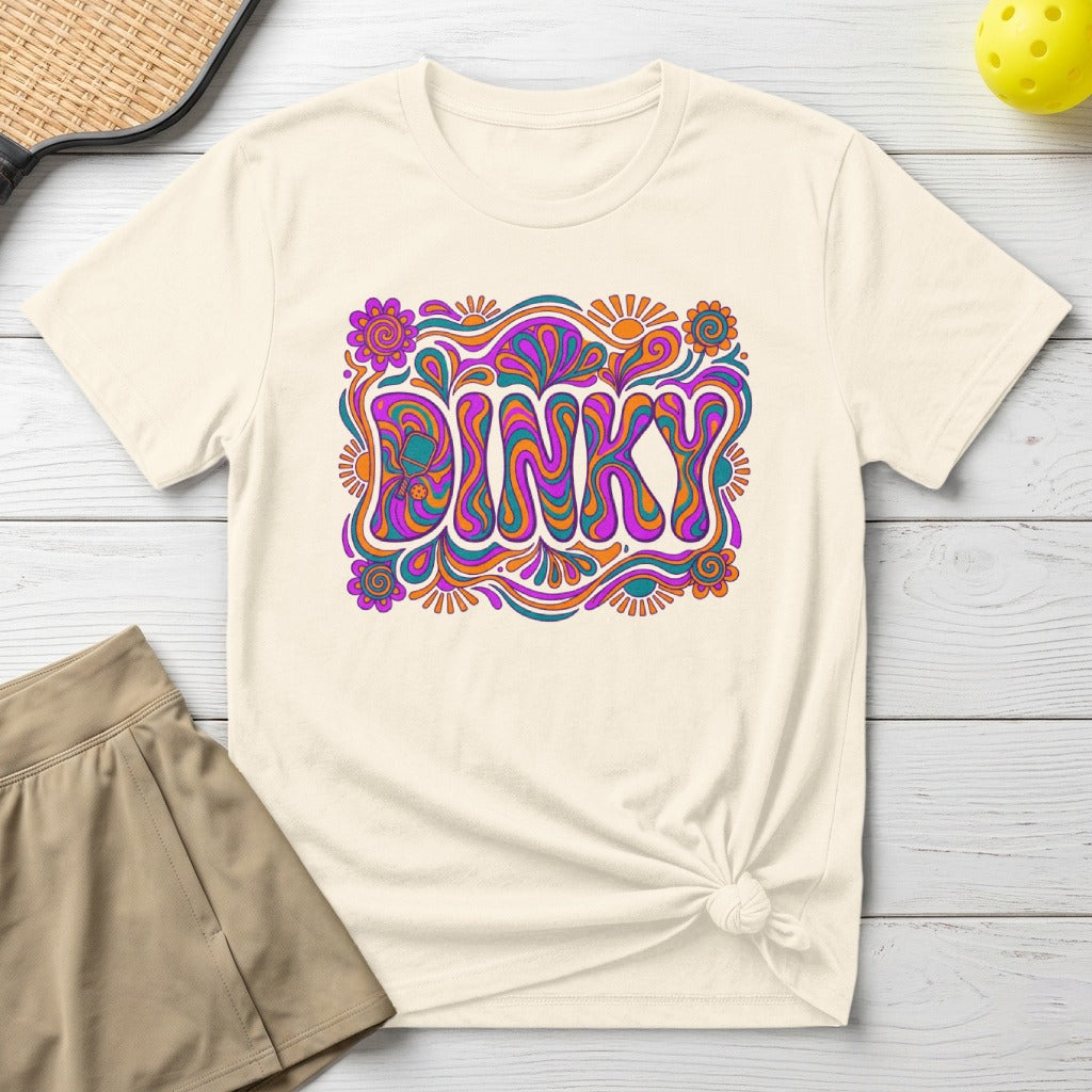Cream t-shirt with colorful "DINKY" text in a groovy, psychedelic font.