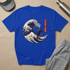 Blue t-shirt with a distressed wave design featuring a paddle and text.