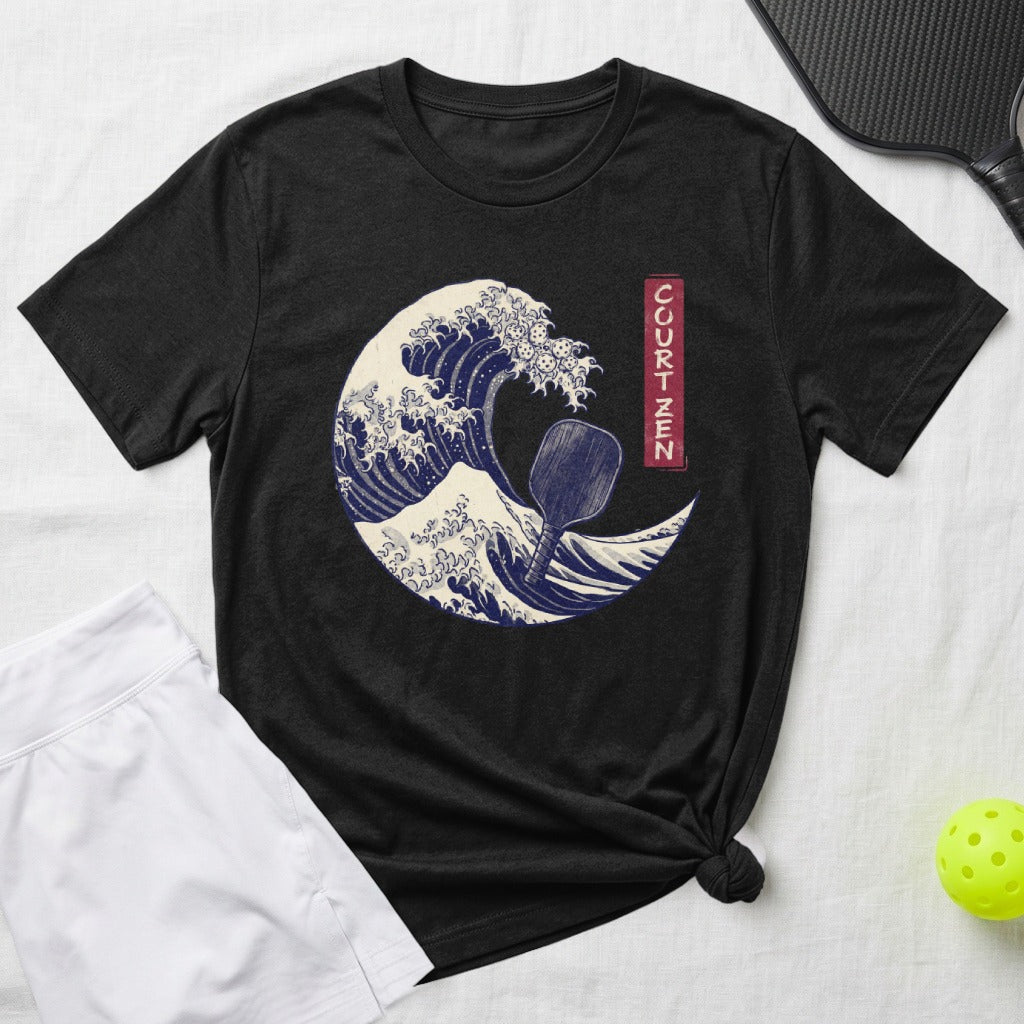 Black t-shirt with a wave design and a pickleball paddle.