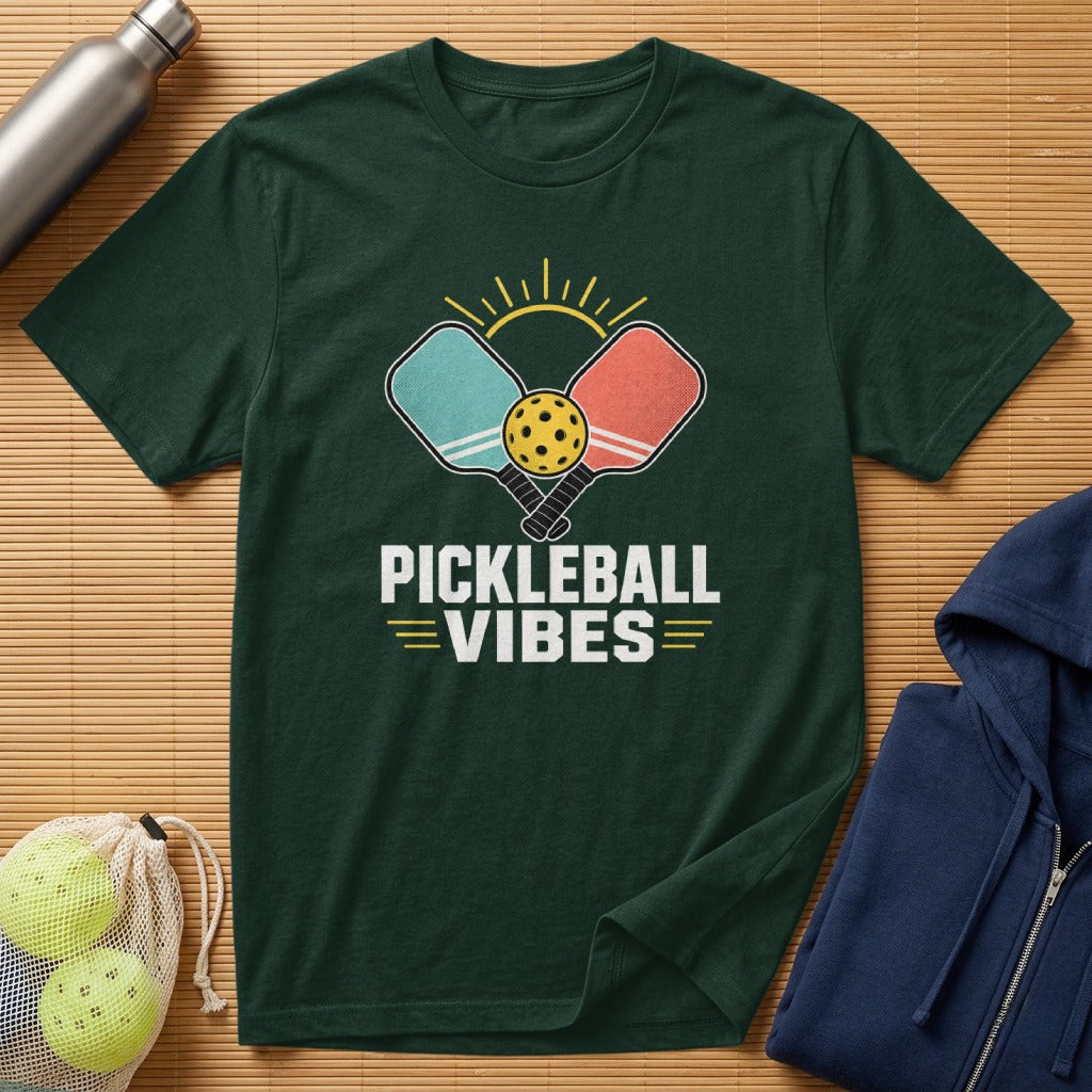 Dark green t-shirt with pickleball paddles, ball, sun, and "Pickleball Vibes" text.