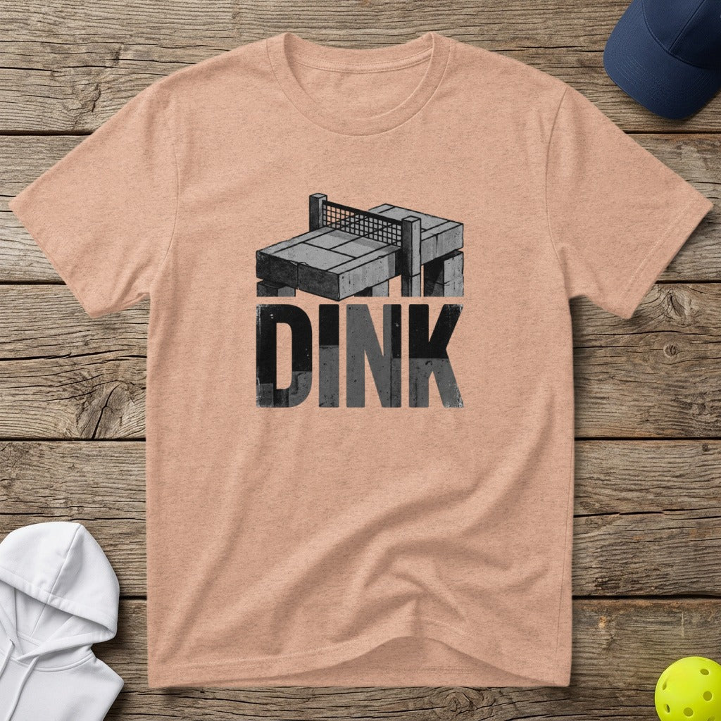 Peach t-shirt with "DINK" in distressed grey letters and a pickleball court graphic.