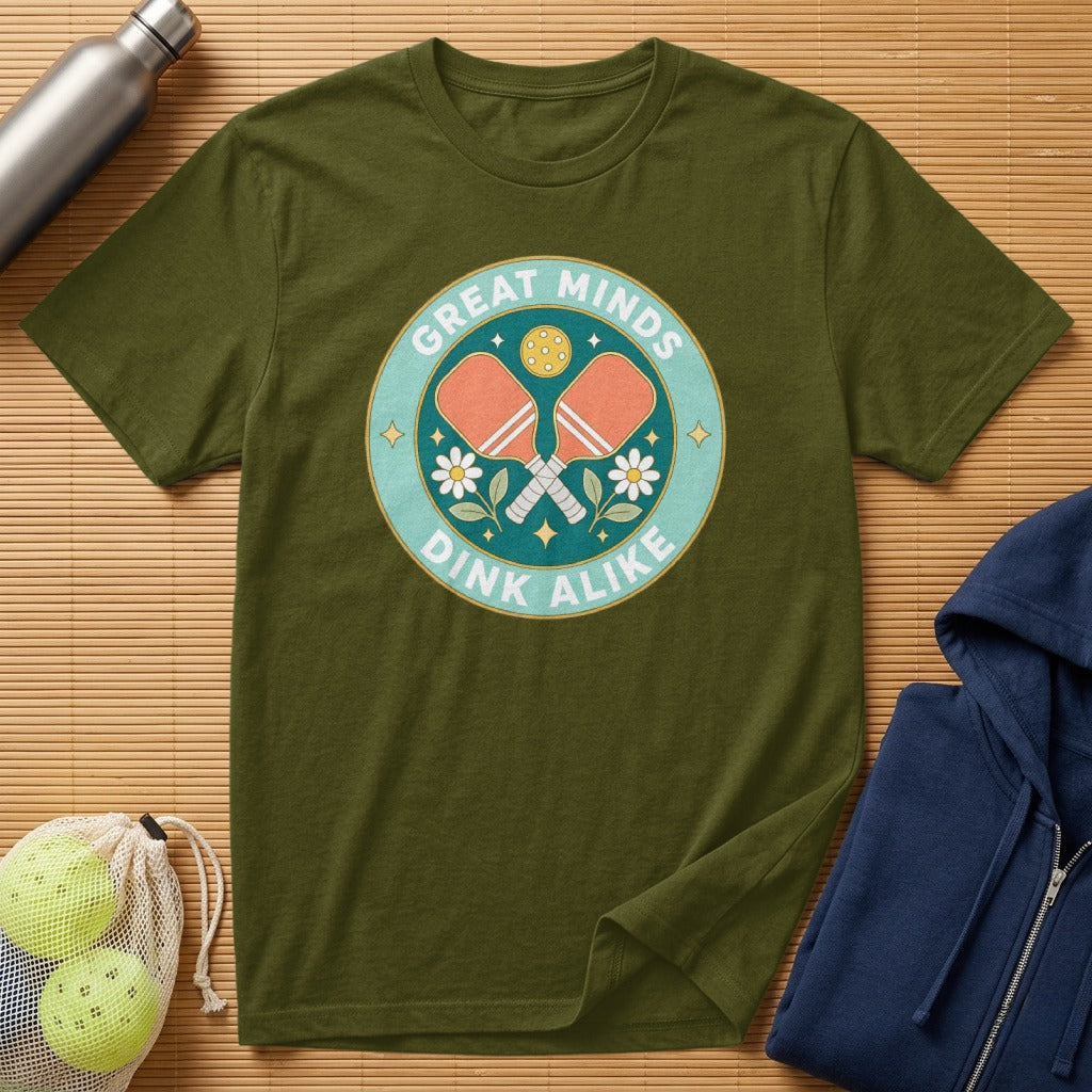 Olive green t-shirt with "Great Minds Dink Alike" pickleball graphic.