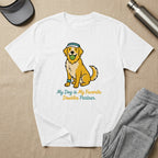 Golden retriever wearing a blue hat holds a green ball in its mouth.