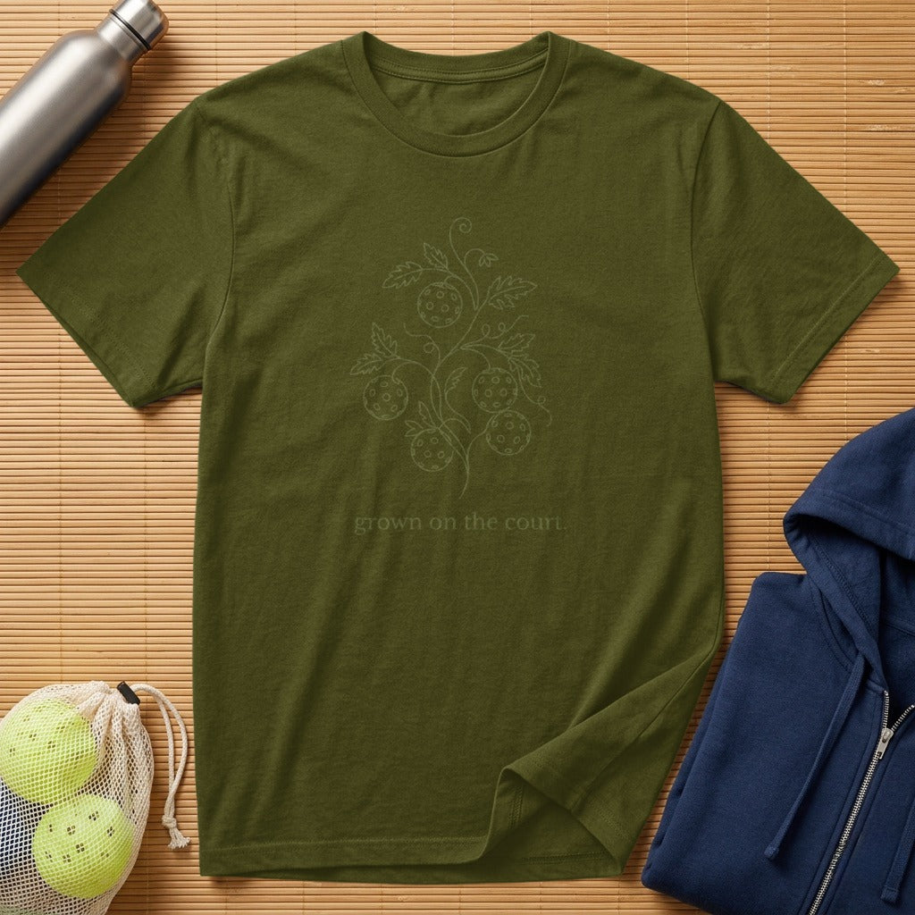 Olive green t-shirt with a floral pickleball design and text.