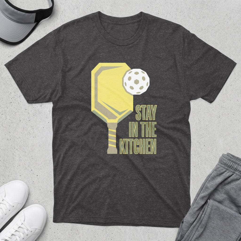Dark t-shirt with a pickleball paddle, ball, and "Stay in the Kitchen" text.