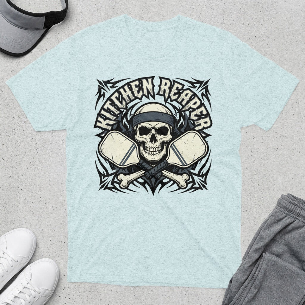 Skull with crossed pickleball paddles on a t-shirt, reads "Kitchen Reaper".