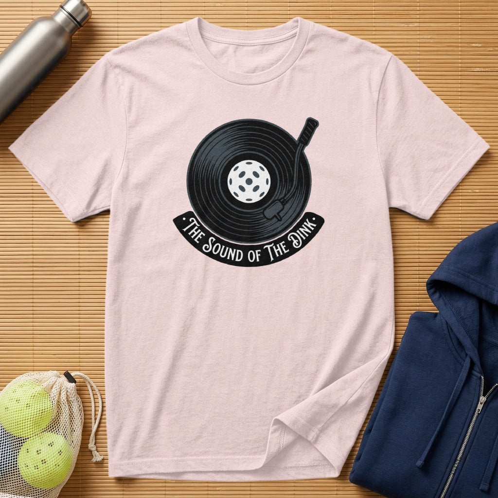Pink t-shirt with "The Sound of the Dink" and record player graphic.