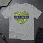 Gray t-shirt with heart shape made of pickleballs and text "Love at First Dink".