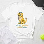 White t-shirt with illustration of a golden retriever holding a pickleball.