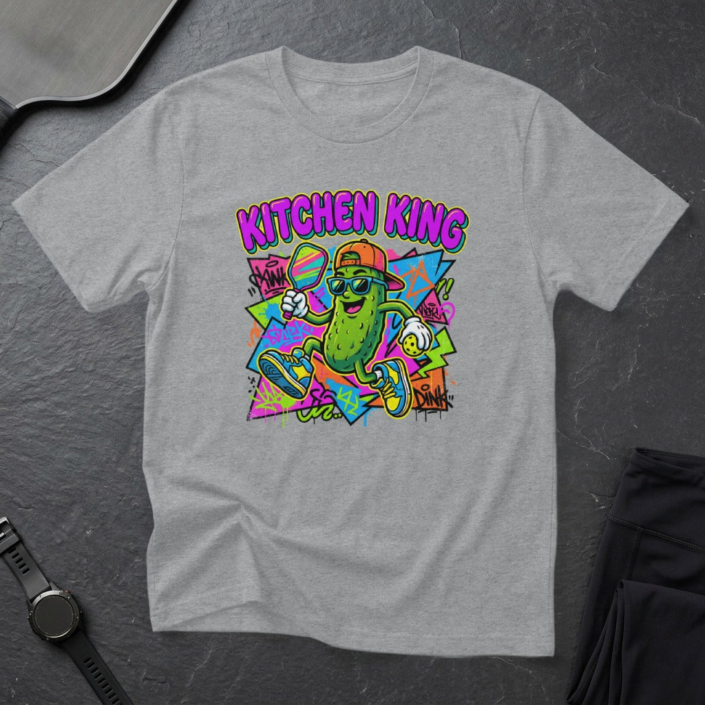 Cartoon pickle character wearing sunglasses and holding a tennis racket, with "Kitchen King" text.