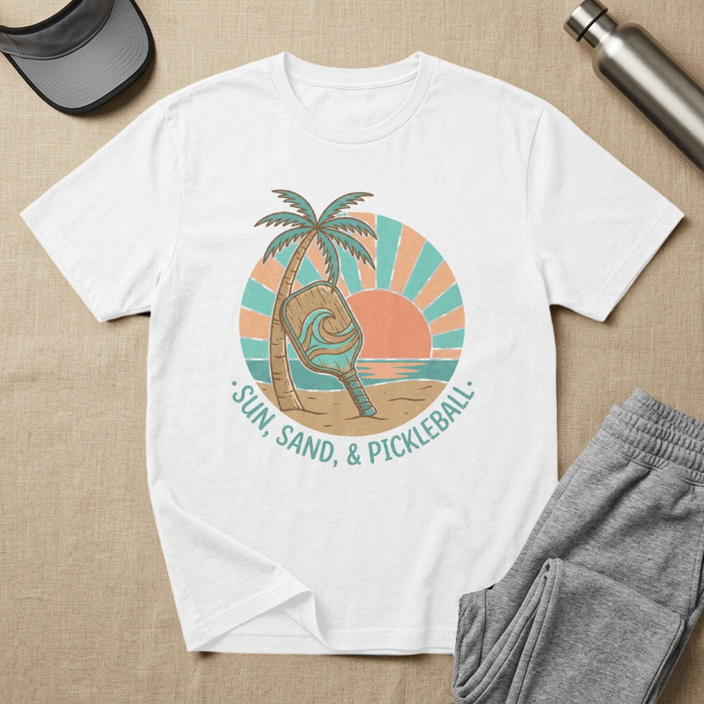 White t-shirt with "Sun, Sand, & Pickleball" text and graphic.