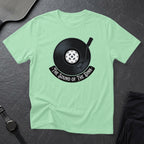 T-shirt with a record and pickleball graphic, text "The Sound of the Dink".