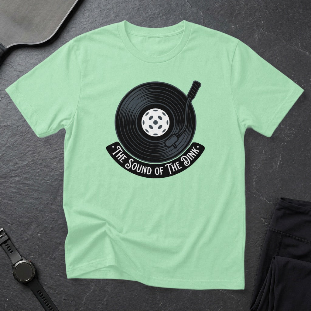 T-shirt with a record and pickleball graphic, text "The Sound of the Dink".