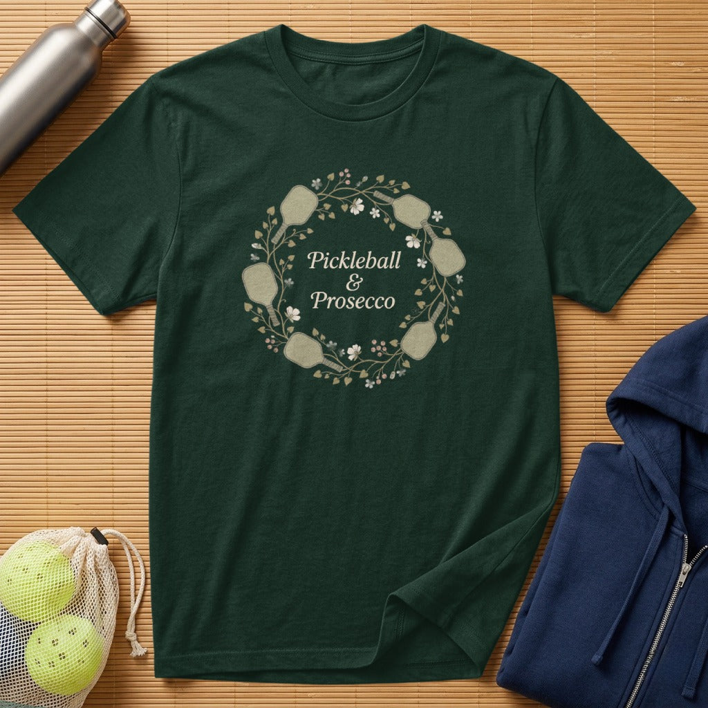 Dark green t-shirt with floral pickleball graphic and text.