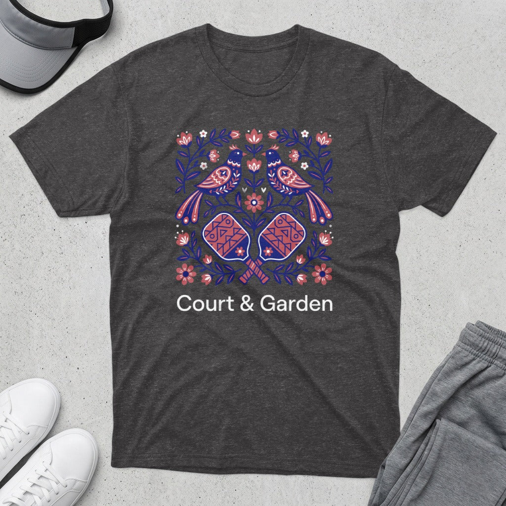 Dark t-shirt with a floral design featuring two birds and two pickleball paddles.