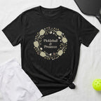 Black t-shirt with "Pickleball & Prosecco" in a floral wreath graphic.