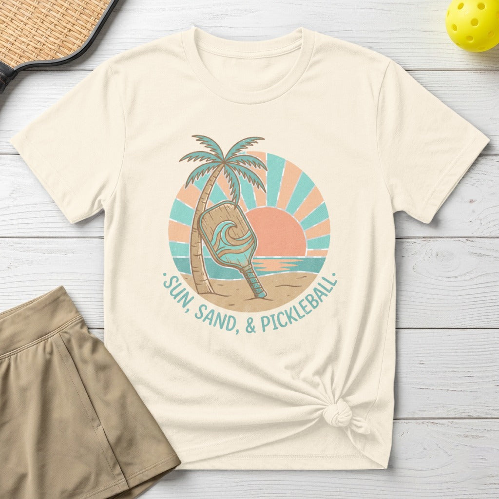 Cream t-shirt with "Sun, Sand, & Pickleball" text and beach scene.