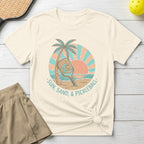 Cream t-shirt with "Sun, Sand, & Pickleball" text and beach scene.