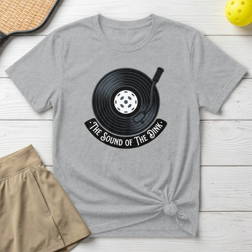T-shirt with graphic of a record and pickleball, reading "The Sound of the Dink".